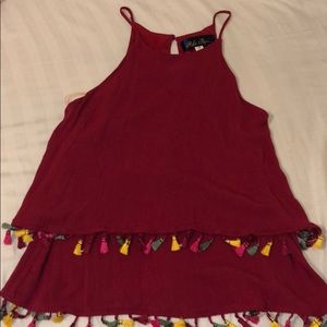 Maroon top with colored tassels